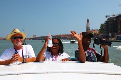 Tourists going around venice on a Water Taxi
